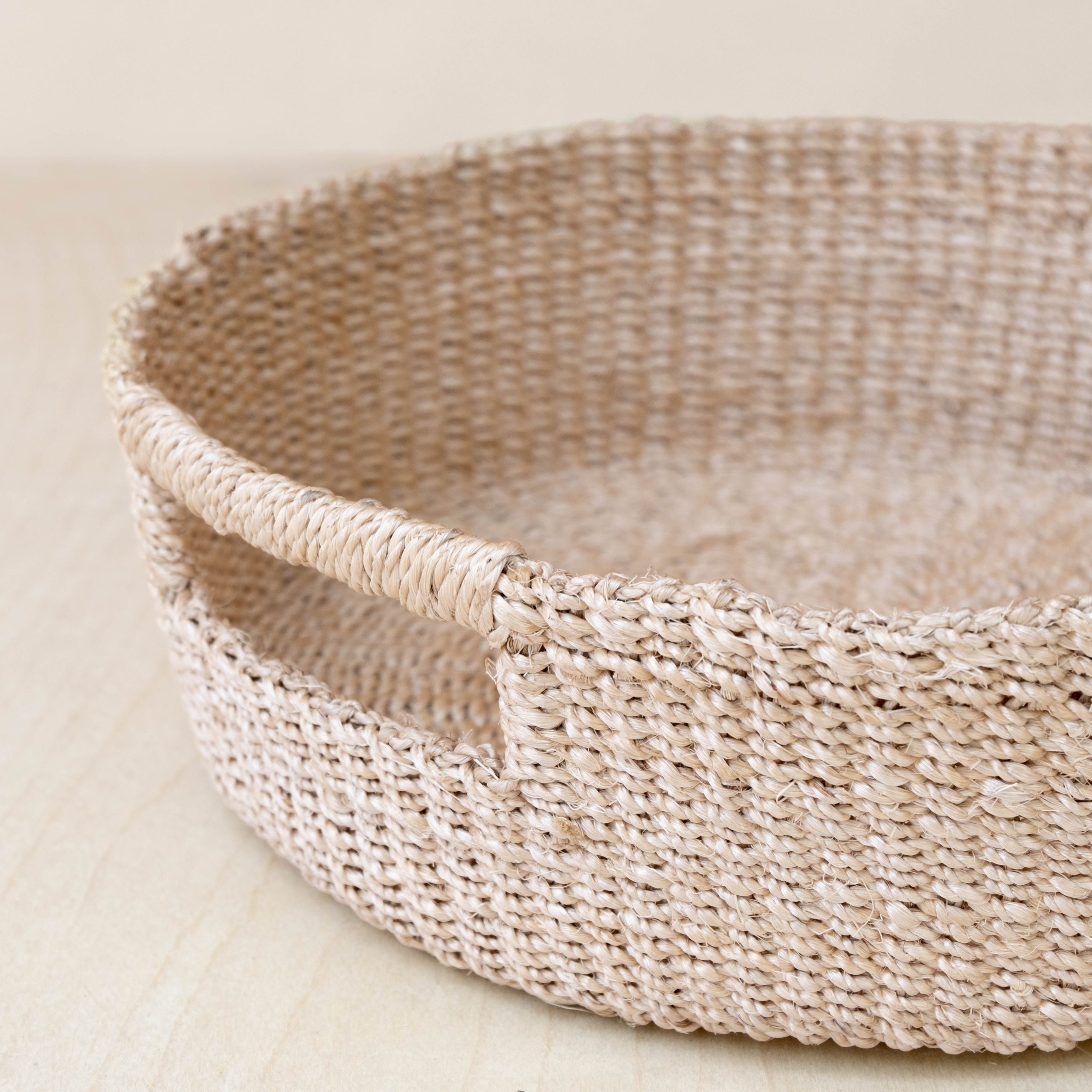 LIKHA_80117_Abaca-Round-Tray-with-Cutout-Handles-2.jpg